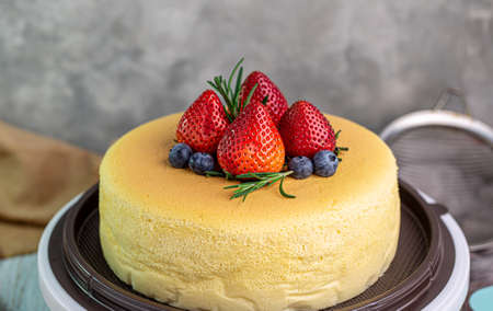 Homemade Taiwanese castella cake with strawberry and blueberry toppings, close-upの写真素材