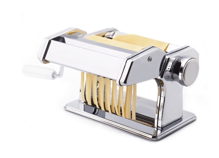 Pasta machine with fresh noodles, Homemade Pasta, isolated on white backgroundの写真素材