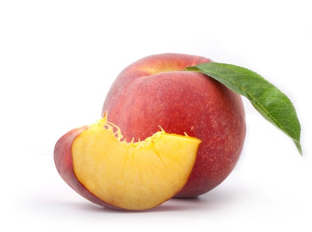 Composition of fresh peaches with leaf, isolated on white background, with clipping pathsの写真素材