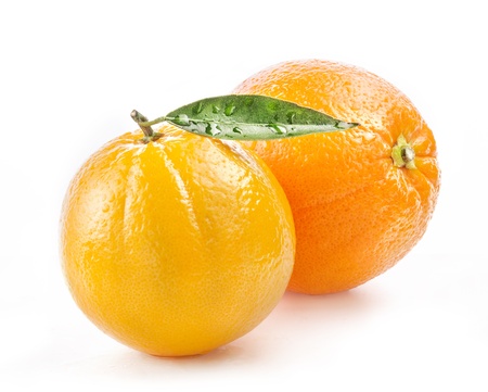 Ripe orange fruit with leaf and water drops isolated on white backgroundの写真素材