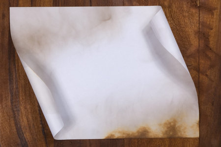 Old paper sheet on wooden backgroundの写真素材