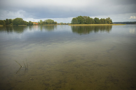 Small island on the lake in Masuria district, Poland