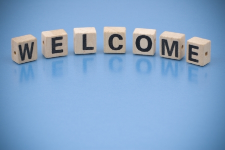 The word WELCOME made of letters on wooden blocksの写真素材