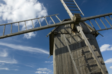 Old wooden windmill in the countrysideの写真素材