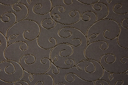 Seamless decorative fabric texture with embroidered plant pattern 