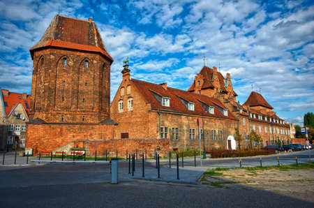 Defensive walls and red brick Gothic tower \Am Stadthof\ in Gdansk, Poland
