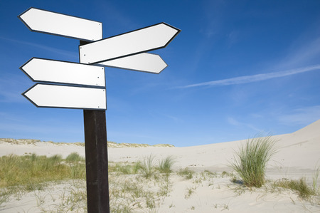 Blank wooden guidepost in vacation sceneryの写真素材