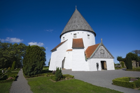Defensive round church in Olsker, Bornholm, Denmark. It is one of four round churches on the Bornholm island. Built about 1150, 26 meter high, considered the most elegant round churchの写真素材