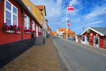 ALLINGE, DENMARK - AUGUST 24, 2018: Traditional colorful half-timbered houses in the narrow, cobbled street on the Baltic Sea coast , Bornholmのeditorial素材