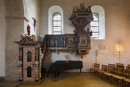 AAKIRKEBY, DENMARK - AUGUST 19, 2018: View of a Renaissance pulpit in Aa church. It is the biggest and oldest church on the Bornholm island.のeditorial素材