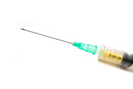Syringe with pills on white backgroundの写真素材
