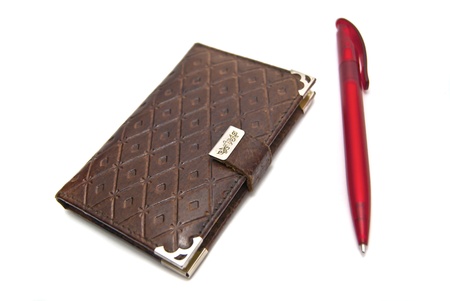 Notebook with pen on whiteの写真素材