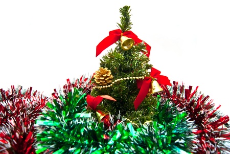 Tinsel fragment and Christmas tree on whiteの写真素材