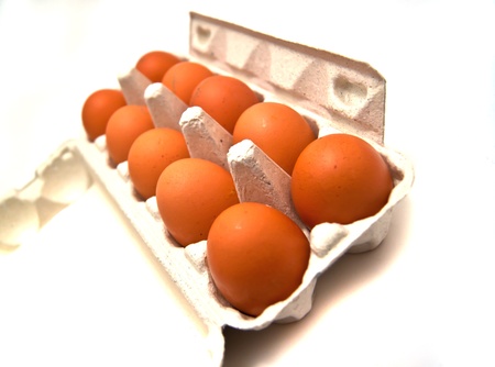 Carton box with eggs on whiteの写真素材