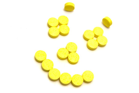 Tablets smiling face on white background