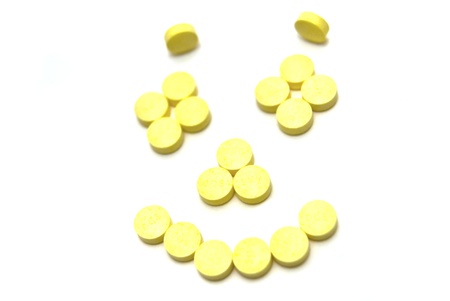 Pills smiling face on white backgroundの写真素材
