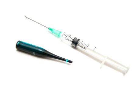 Syringe and ampoule close-up on white backgroundの写真素材