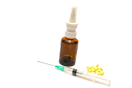 Syringe, tablets and bottle on white backgroundの写真素材