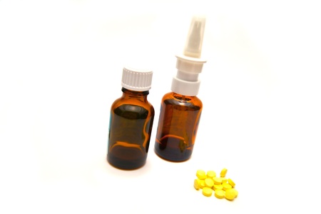 Bottles and tablets on white backgroundの写真素材