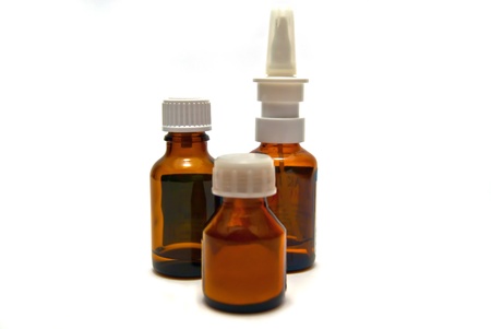 Three bottles of medication on white backgroundの写真素材