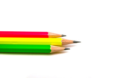 three pencils close-up on white background