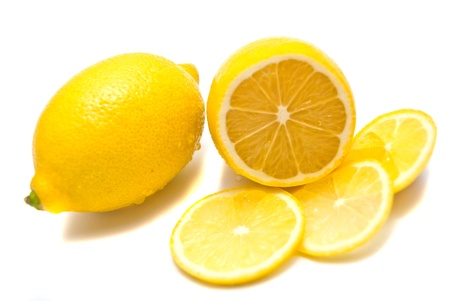 Fresh lemon and lemon slices on whiteの写真素材