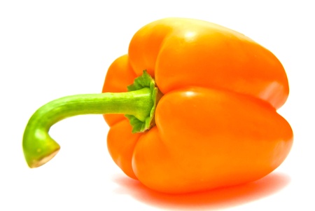 Orange pepper close-up on white の写真素材
