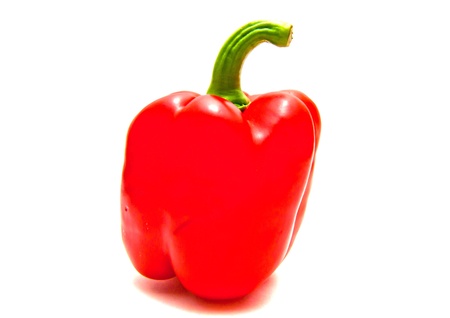 Single red pepper close-up on white backgroundの写真素材