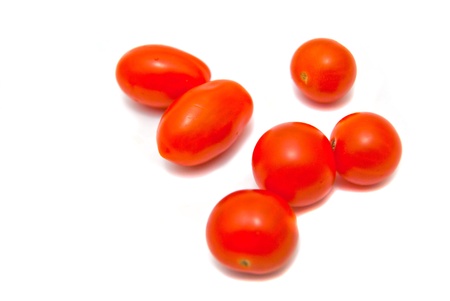 fresh cherry tomatoes on white backgroundの写真素材