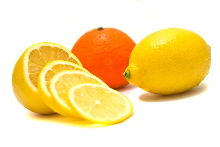 lemon and tangerine close-up on white の写真素材