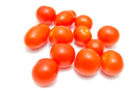 fresh cherry tomatoes close-up on whiteの写真素材