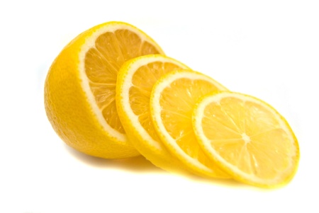 Lemon slices and lemon on whiteの写真素材