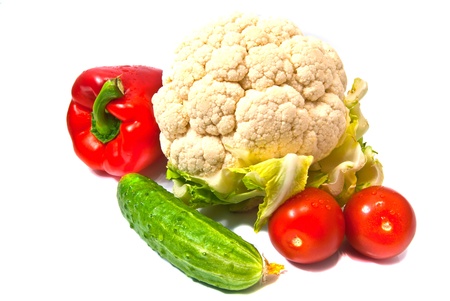 cauliflower, peppers, cucumbers and tomatoes on whiteの写真素材