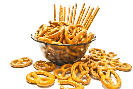 salted pretzels and breadsticks on a plateの写真素材