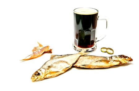 dark beer and stockfishon white closeupの写真素材
