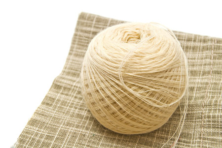 tangle white yarn on fabric closeup on white