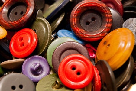texture of many colorful clothing buttons closeupの写真素材