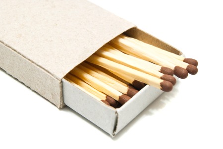 matchbox with some matches on white background closeupの写真素材