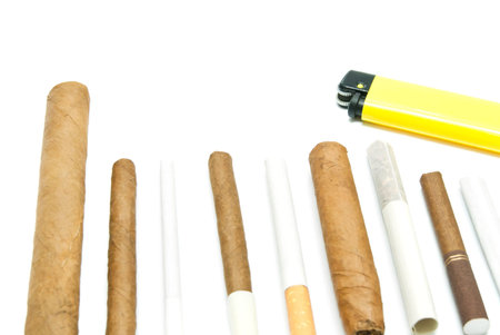 different cigars and cigarettes on white background closeup