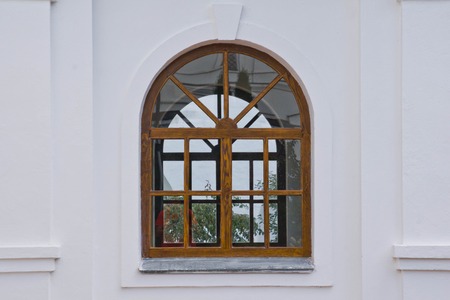 window in a wooden frame of the old manorの写真素材