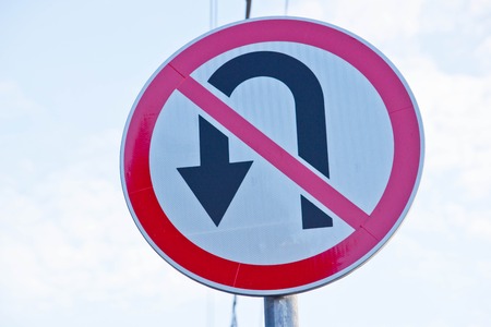 road sign "ban reversal" on the sky backgroundの写真素材