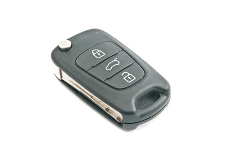 black car keys with alarm on white background