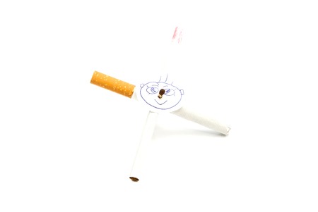 portrait on the cross of cigarettes on white backgroundの写真素材