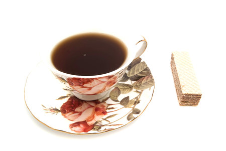 wafer and cup of tea on white closeupの写真素材