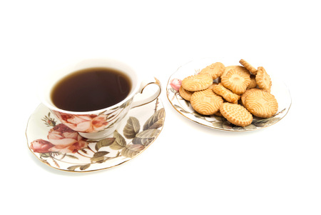cup of tea and cookies on white closeupの写真素材