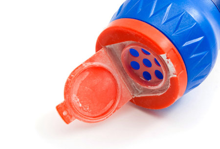 bottle with powder closeup on white background