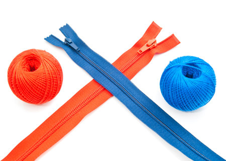colored zippers and tread on white background