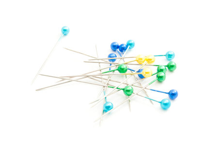 pins for needlework closeup on white background