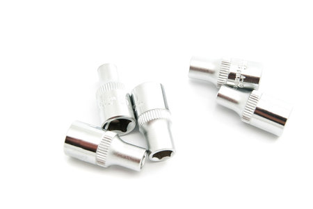 different metal heads on white background closeup