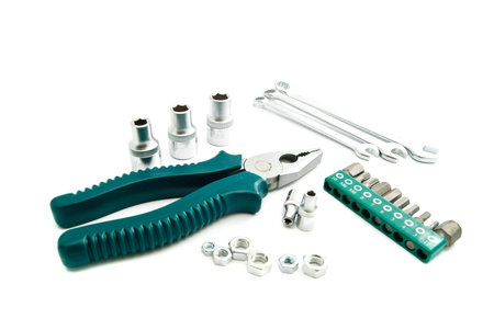 pliers, various wrenches and heads on white background